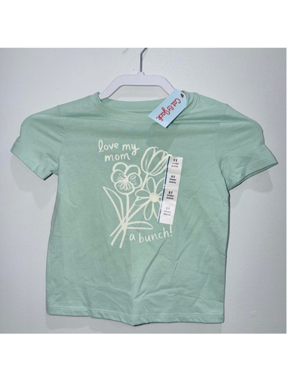 Girls size 5T green girl tee with white floral graphic and 'love my mom a bunch